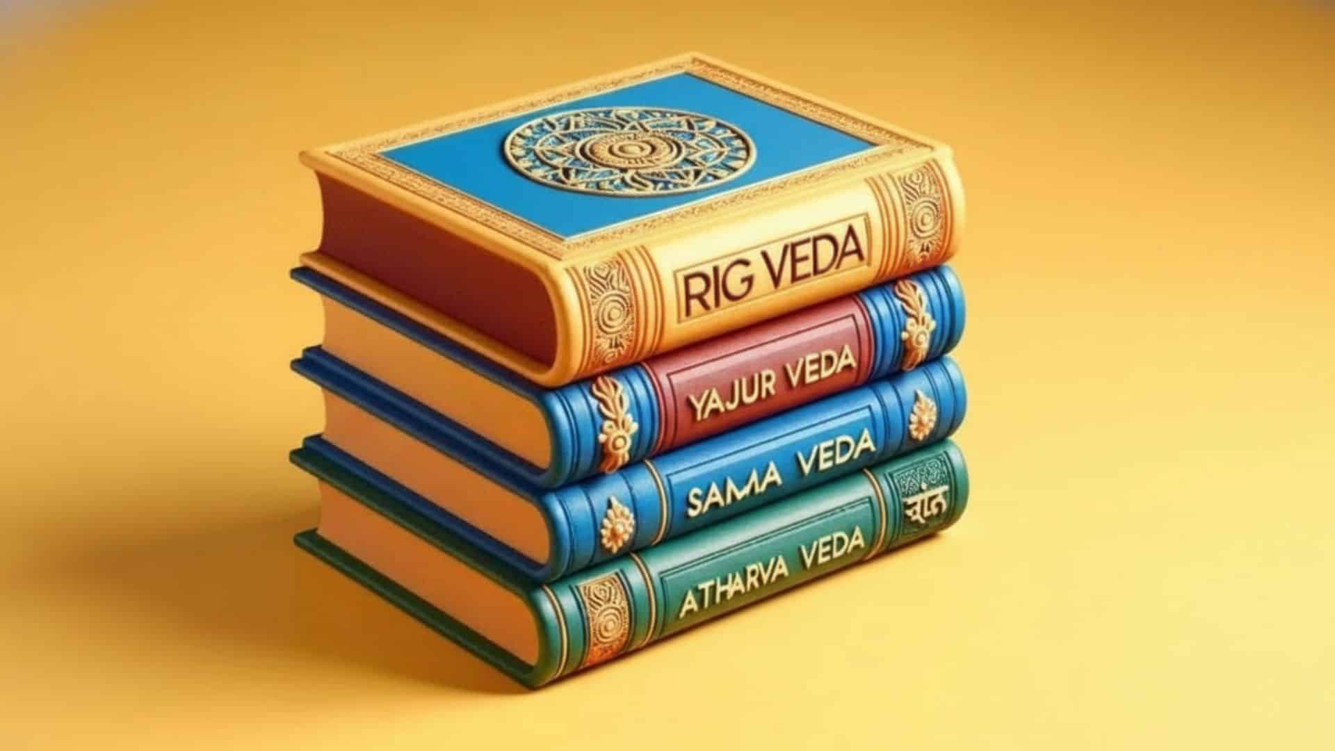 stack of four books labeled rig veda yajur veda sama veda and atharva veda
